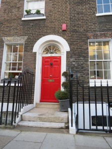 Nothing more is necessary to compliment the beautiful simplicity of this Chelsea Georgian house than a red door.