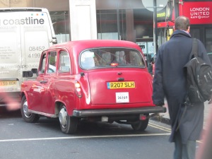 A beautiful blood-red Fairway. Other popular colours of this model were grren, white and charcoal grey. So where did the media get the lazy phrase of "black cab" from? It's a taxi.
